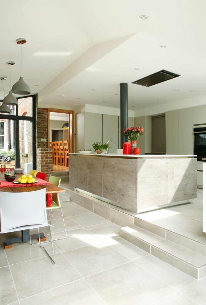 Design ideas for a large urban kitchen/diner in Hertfordshire with flat-panel cabinets and an island.