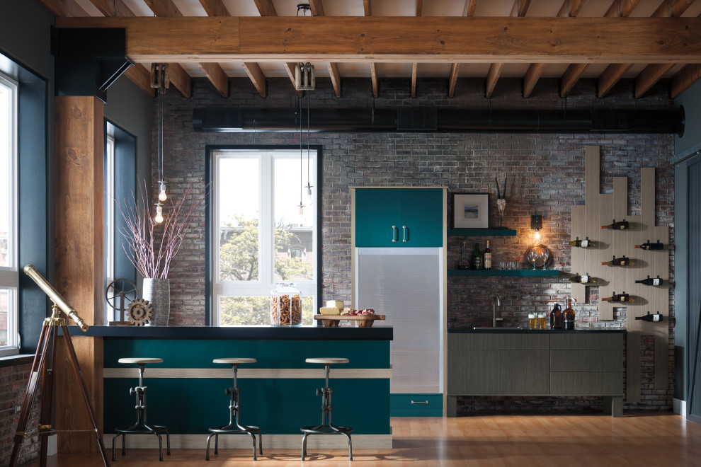Example of a mid-sized urban eat-in kitchen design in Chicago with flat-panel cabinets, turquoise cabinets, brick backsplash, stainless steel appliances and a peninsula