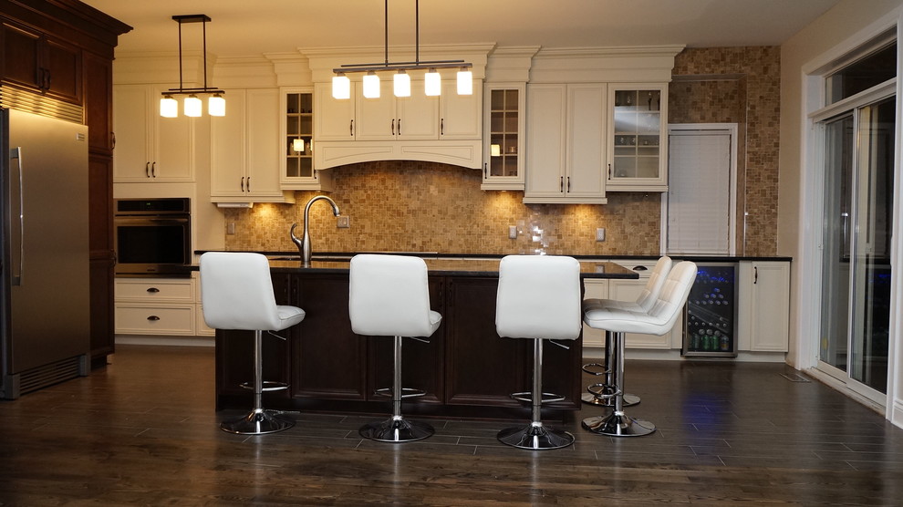 This is an example of a large modern l-shaped open plan kitchen in Ottawa with a submerged sink, beaded cabinets, white cabinets, granite worktops, beige splashback, mosaic tiled splashback, stainless steel appliances, porcelain flooring, an island and brown floors.