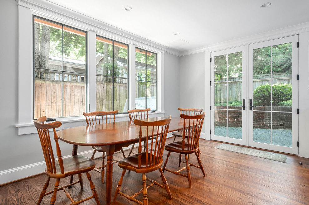 Design ideas for a large modern kitchen/dining room in Atlanta with dark hardwood flooring.