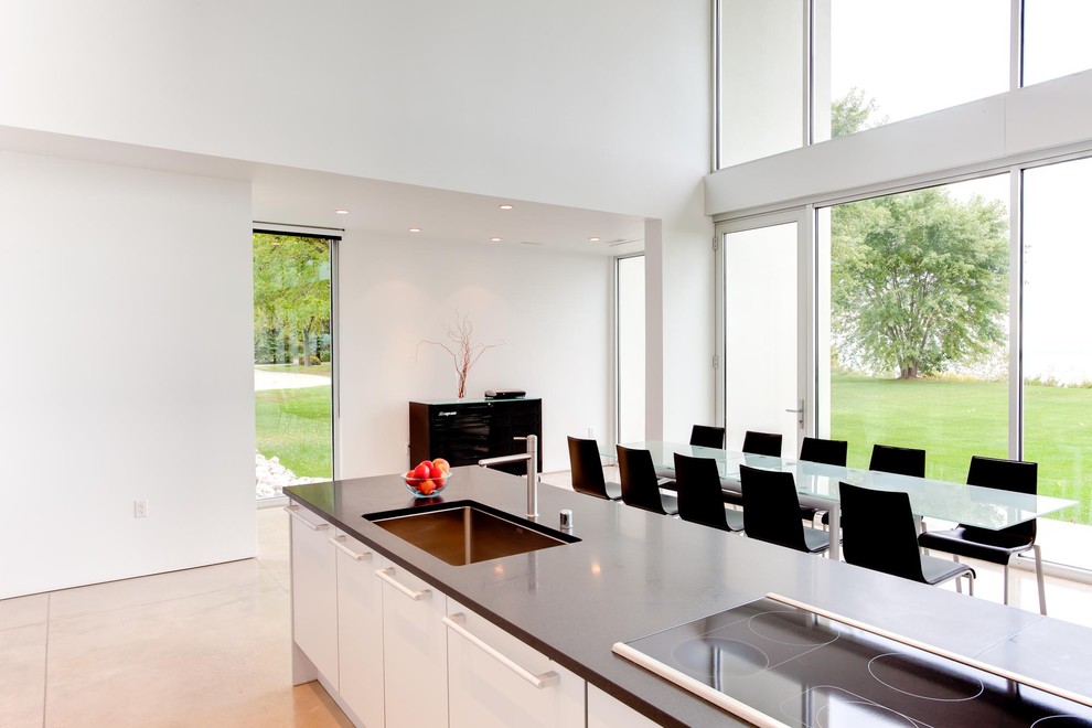 Inspiration for a modern kitchen in Milwaukee with flat-panel cabinets and white cabinets.