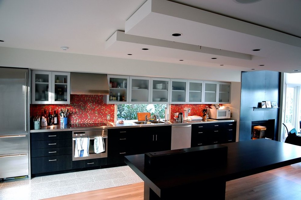 Inspiration for a modern single-wall eat-in kitchen remodel in Seattle with a double-bowl sink, beaded inset cabinets, red backsplash and an island