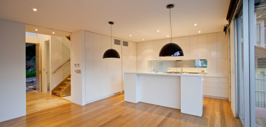 На фото: кухня среднего размера в стиле модернизм с кладовкой, открытыми фасадами и островом с