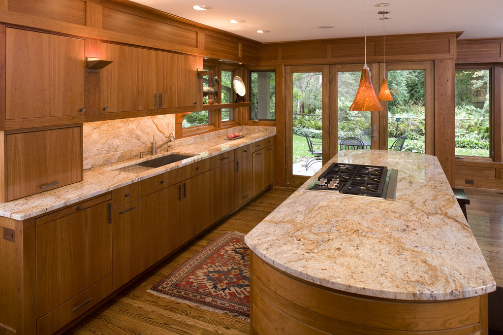 Foto på ett funkis kök, med granitbänkskiva