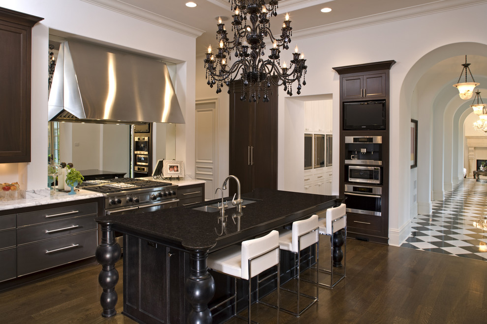 This is an example of a mediterranean kitchen in Minneapolis with stainless steel appliances.