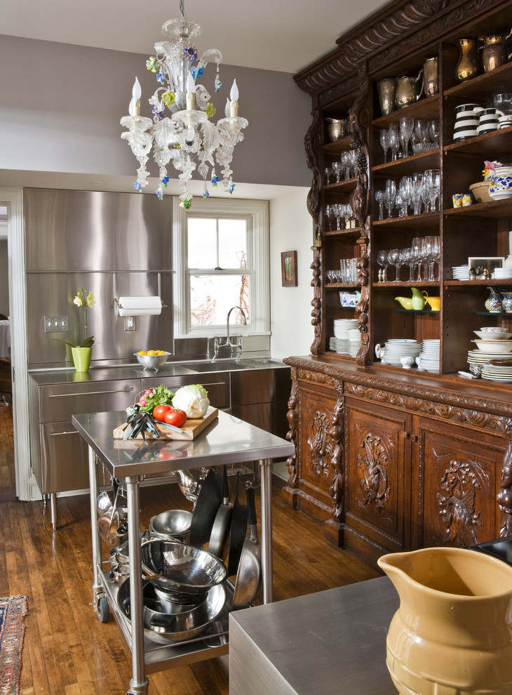 Kitchen - eclectic kitchen idea in Other with stainless steel countertops, an integrated sink, open cabinets, dark wood cabinets, metallic backsplash and metal backsplash