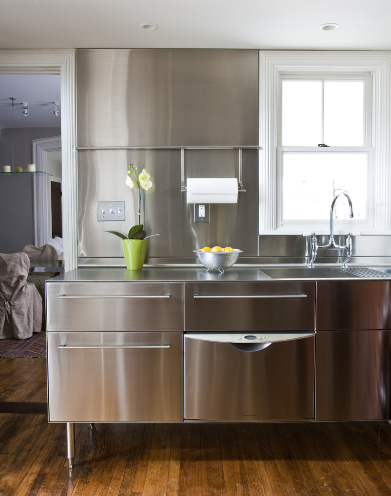 Transitional kitchen photo in Other with stainless steel countertops, an integrated sink, stainless steel cabinets, metallic backsplash, metal backsplash, stainless steel appliances and flat-panel cabinets
