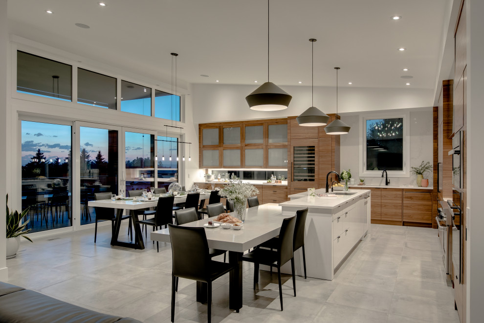Design ideas for a large modern l-shaped kitchen/diner in Calgary with a submerged sink, flat-panel cabinets, medium wood cabinets, engineered stone countertops, white splashback, marble splashback, integrated appliances, ceramic flooring, an island, grey floors and white worktops.