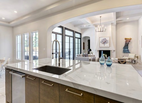 Bright open-plan kitchen with sleek island and black sink — inspiration for Scratch-Resistant Melamine cabinetry