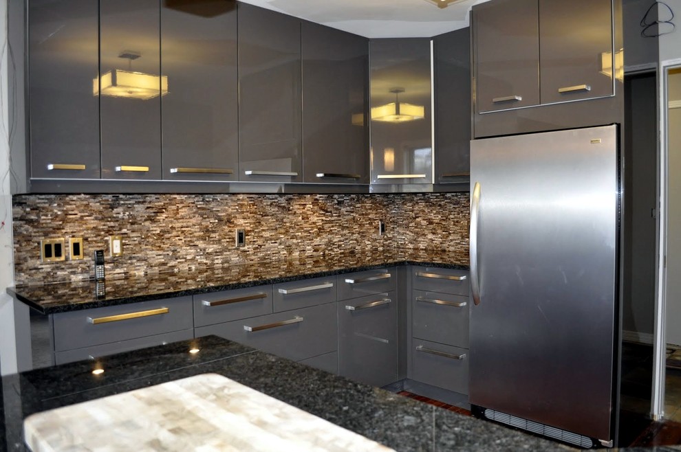 Photo of a medium sized modern u-shaped kitchen/diner in Calgary with a built-in sink, flat-panel cabinets, grey cabinets, granite worktops, multi-coloured splashback, mosaic tiled splashback, stainless steel appliances, medium hardwood flooring and a breakfast bar.