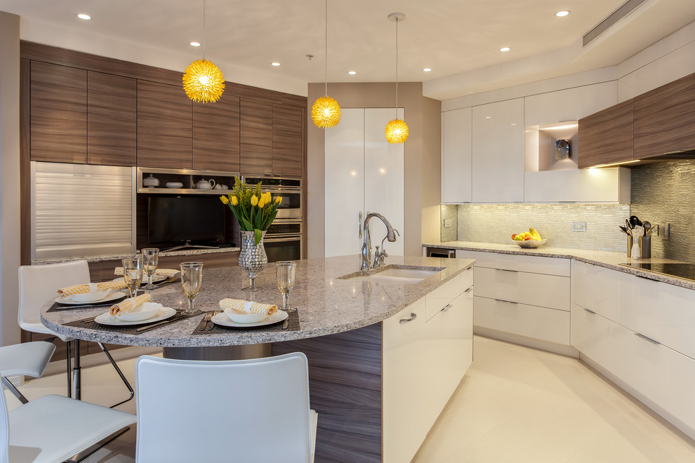 Photo of a medium sized contemporary u-shaped kitchen/diner in Denver with a submerged sink, glass-front cabinets, white cabinets, engineered stone countertops, brown splashback, glass sheet splashback, stainless steel appliances, porcelain flooring and an island.