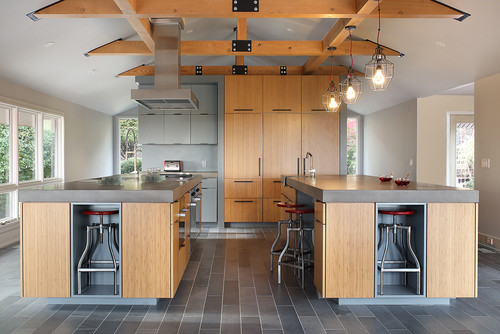 Modern kitchen design with plywood and MDF cabinet materials, dual islands, and exposed beam ceiling