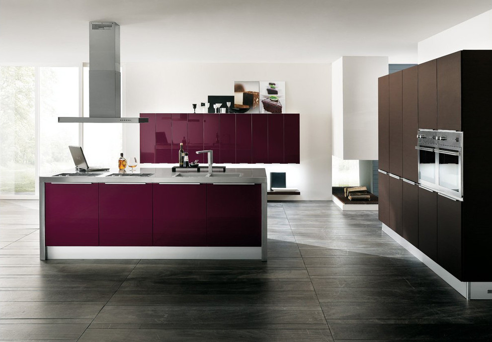 This is an example of a large modern kitchen in Miami with flat-panel cabinets, purple cabinets, stainless steel worktops, stainless steel appliances, an island and grey floors.