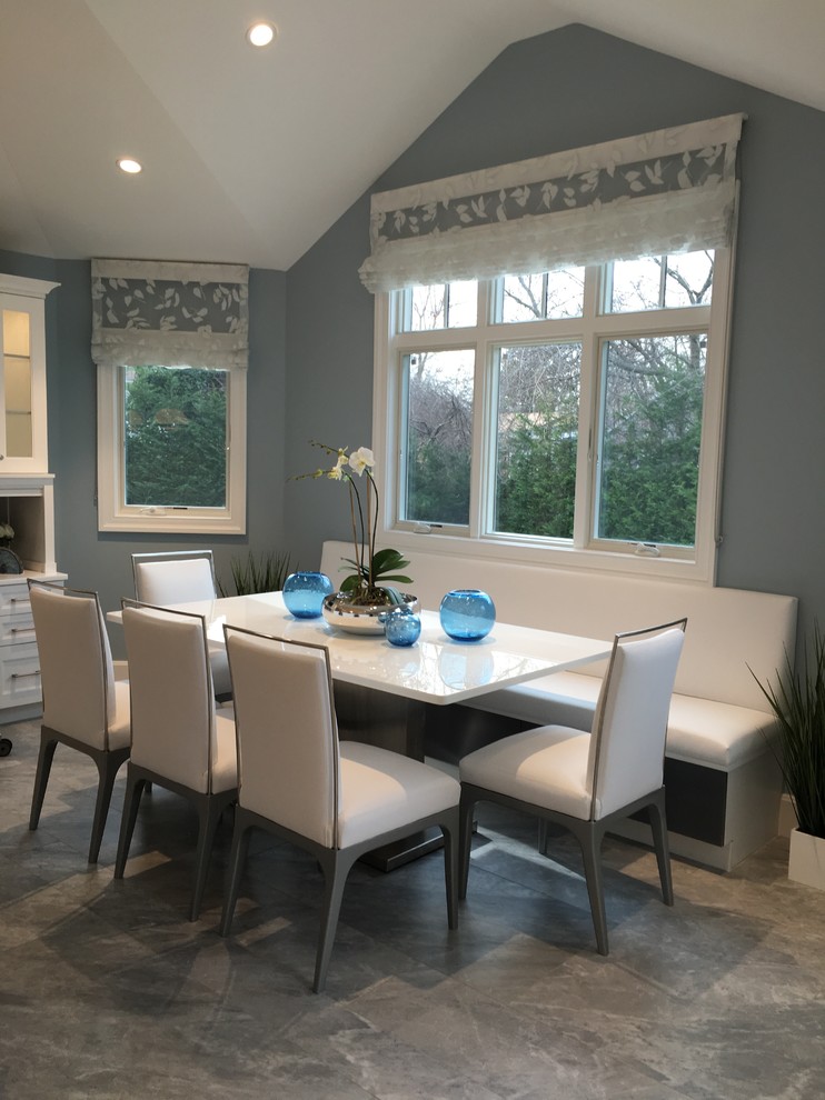 Inspiration for a huge modern u-shaped ceramic tile eat-in kitchen remodel in New York with a single-bowl sink, shaker cabinets, white cabinets, quartzite countertops, gray backsplash, glass sheet backsplash, stainless steel appliances and two islands