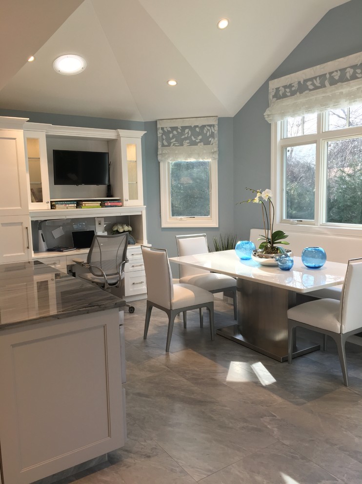 Huge trendy u-shaped ceramic tile eat-in kitchen photo in New York with a single-bowl sink, shaker cabinets, white cabinets, quartzite countertops, gray backsplash, glass sheet backsplash, stainless steel appliances and two islands