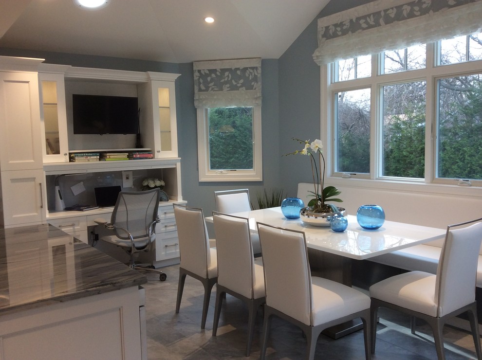 Eat-in kitchen - huge contemporary u-shaped ceramic tile eat-in kitchen idea in New York with a single-bowl sink, shaker cabinets, white cabinets, quartzite countertops, gray backsplash, glass sheet backsplash, stainless steel appliances and two islands