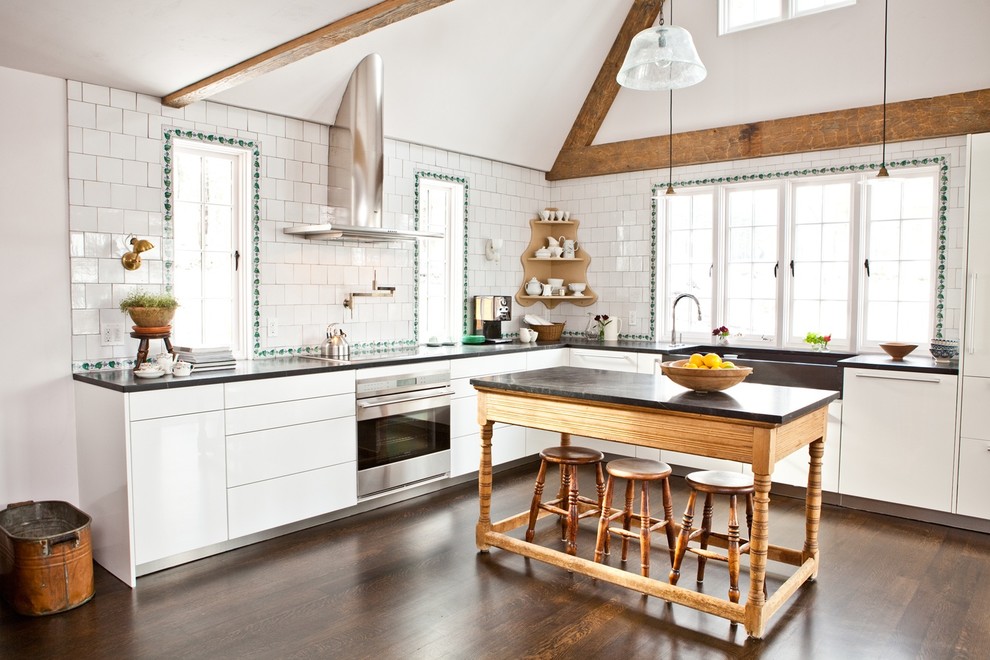 Kitchen - traditional kitchen idea in Boston with flat-panel cabinets, white cabinets, a farmhouse sink and white backsplash