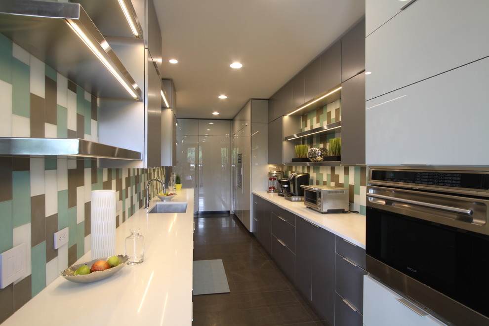 Example of a large trendy galley light wood floor kitchen pantry design in Grand Rapids with an undermount sink, flat-panel cabinets, white cabinets, quartz countertops, stainless steel appliances and two islands