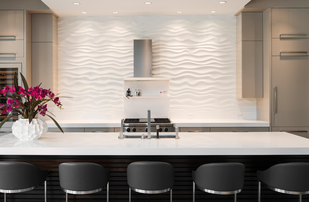 Inspiration for a large contemporary single-wall porcelain tile open concept kitchen remodel in Miami with an undermount sink, flat-panel cabinets, beige cabinets, quartz countertops, white backsplash, stainless steel appliances and an island