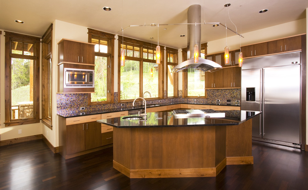 Photo of a medium sized contemporary l-shaped kitchen/diner in Denver with shaker cabinets, medium wood cabinets, granite worktops, multi-coloured splashback and stainless steel appliances.