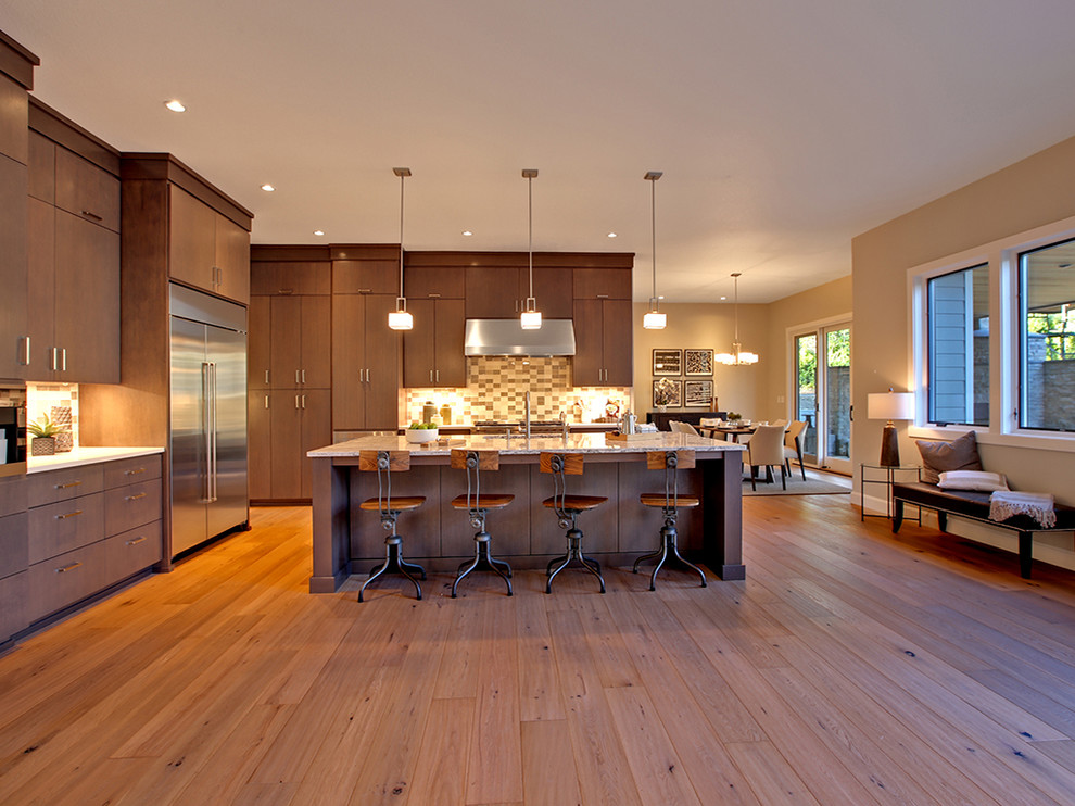 Large trendy l-shaped light wood floor and beige floor open concept kitchen photo in Portland with an undermount sink, flat-panel cabinets, medium tone wood cabinets, marble countertops, multicolored backsplash, limestone backsplash, stainless steel appliances and an island