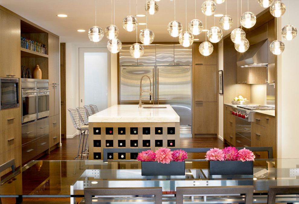 Mid-sized trendy u-shaped dark wood floor open concept kitchen photo in Chicago with flat-panel cabinets, light wood cabinets, stainless steel appliances, an undermount sink, marble countertops, beige backsplash and an island