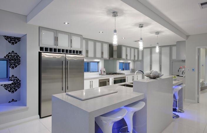 Inspiration for a medium sized modern single-wall open plan kitchen in Perth with a submerged sink, flat-panel cabinets, white cabinets, granite worktops, grey splashback, glass sheet splashback, stainless steel appliances, porcelain flooring and an island.