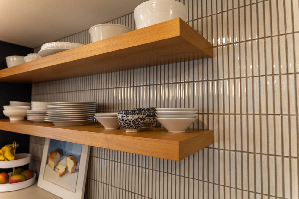 Design ideas for a contemporary kitchen in Denver with white splashback, metro tiled splashback and cork flooring.