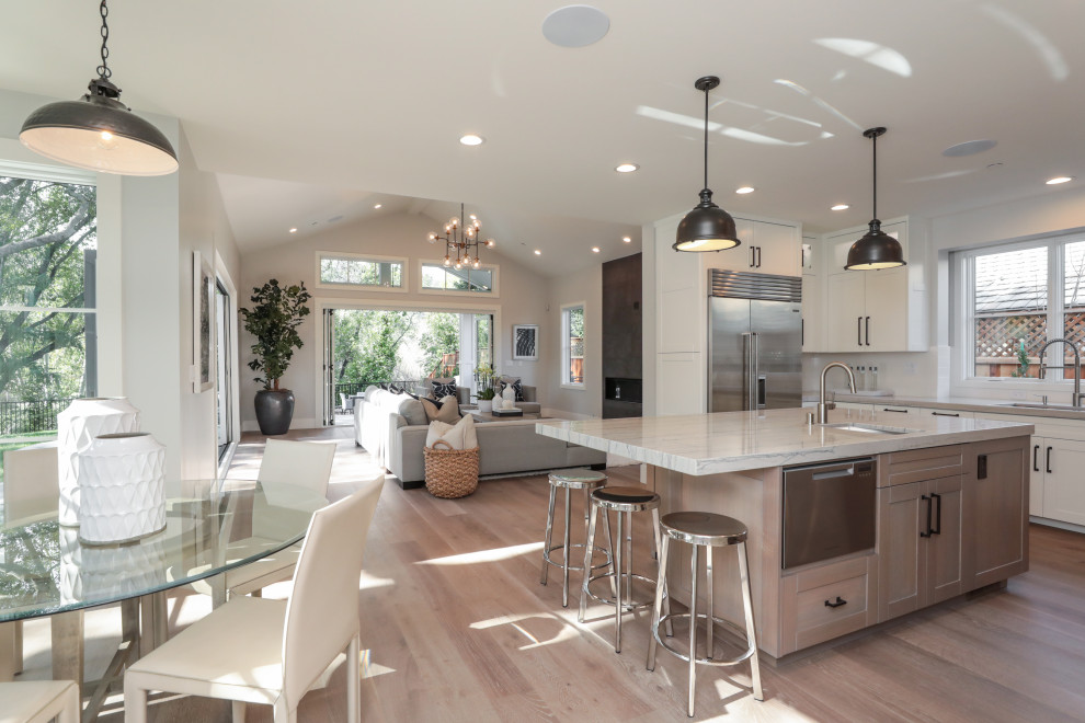 Country u-shaped kitchen photo in San Francisco with an island