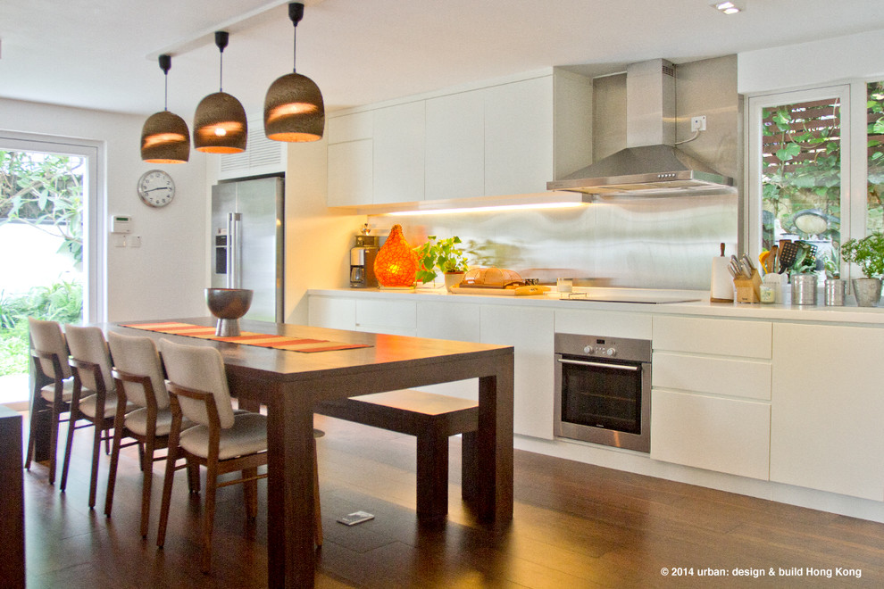Large minimalist l-shaped dark wood floor eat-in kitchen photo in Hong Kong with an island