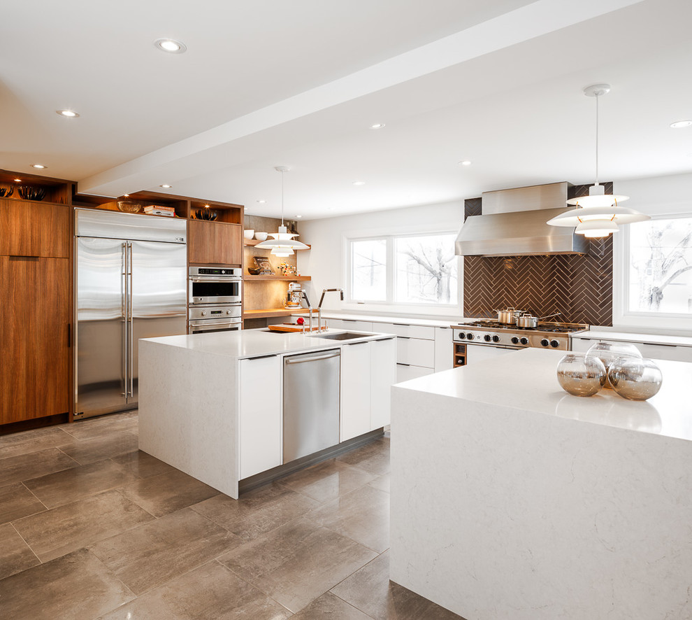 Example of a trendy eat-in kitchen design in Ottawa with an undermount sink, flat-panel cabinets, white cabinets, quartz countertops, black backsplash, subway tile backsplash and stainless steel appliances