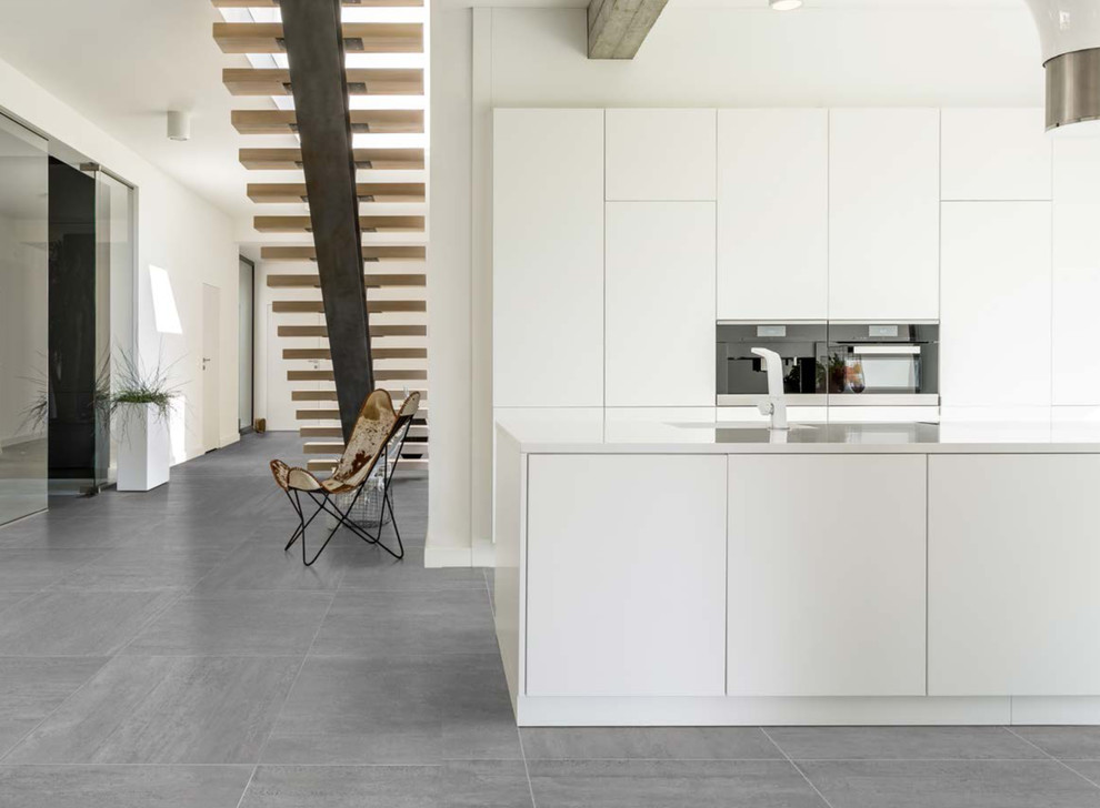 Modern white kitchen with grey porcelain tiled floor - Modern - Kitchen ...