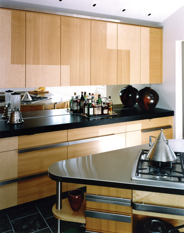 Example of a mid-sized minimalist u-shaped marble floor kitchen design in San Francisco with a double-bowl sink, flat-panel cabinets, light wood cabinets, granite countertops and stainless steel appliances