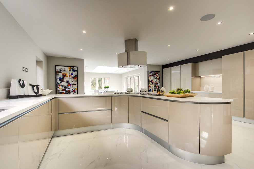 Design ideas for a large modern u-shaped open plan kitchen in Surrey with a submerged sink, flat-panel cabinets, beige cabinets, composite countertops, white splashback, stone slab splashback, black appliances, porcelain flooring, a breakfast bar, white floors and white worktops.