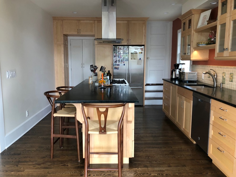 Example of a huge transitional l-shaped dark wood floor and brown floor eat-in kitchen design in Newark with a drop-in sink, recessed-panel cabinets, beige cabinets, quartzite countertops, beige backsplash, ceramic backsplash, stainless steel appliances, an island and black countertops