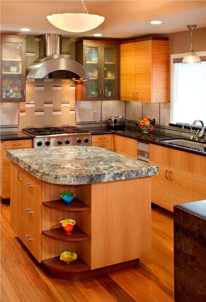 Example of a mid-sized trendy medium tone wood floor open concept kitchen design in San Francisco with a single-bowl sink, flat-panel cabinets, medium tone wood cabinets, marble countertops, gray backsplash, glass tile backsplash, stainless steel appliances and two islands