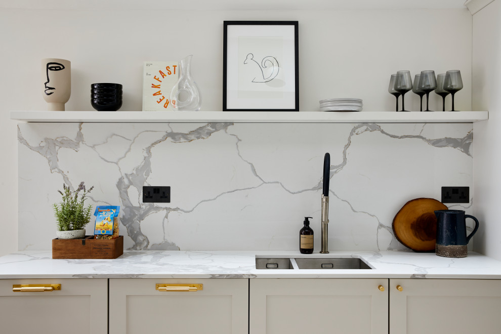 Transitional eat-in kitchen photo in London