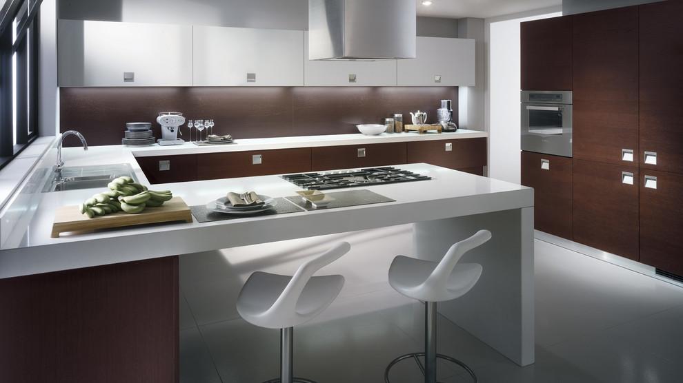 Photo of a large modern u-shaped kitchen/diner in Melbourne with a double-bowl sink, raised-panel cabinets, dark wood cabinets, quartz worktops, brown splashback, stainless steel appliances, ceramic flooring and multiple islands.