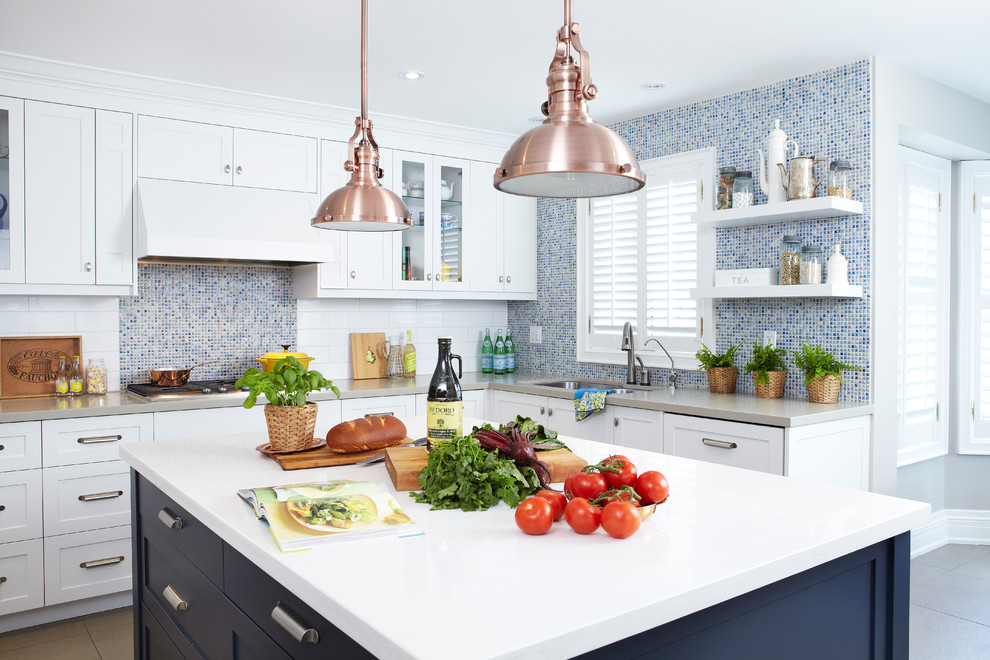 Trendy kitchen photo in Toronto with mosaic tile backsplash, blue backsplash, shaker cabinets, white cabinets and quartz countertops
