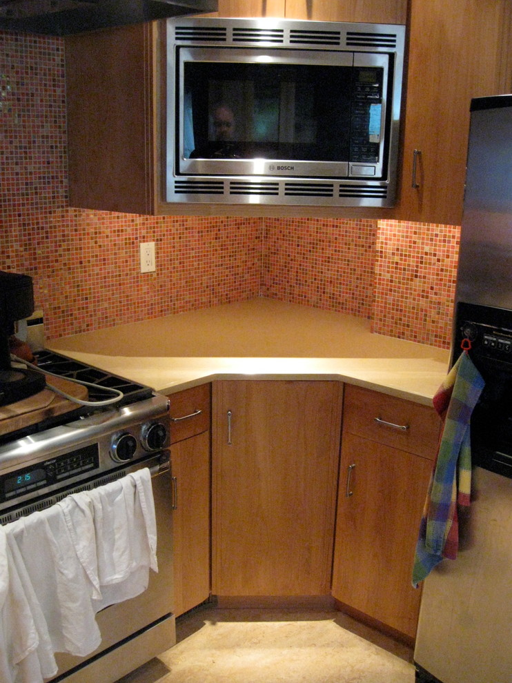This is an example of a small retro kitchen in Portland.