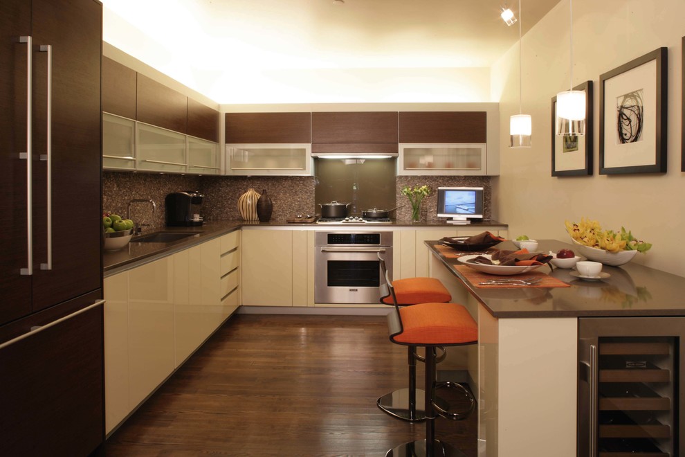 Large u-shaped dark wood floor and brown floor eat-in kitchen photo in Kansas City with a double-bowl sink, raised-panel cabinets, white cabinets, solid surface countertops, multicolored backsplash, mosaic tile backsplash, stainless steel appliances and an island