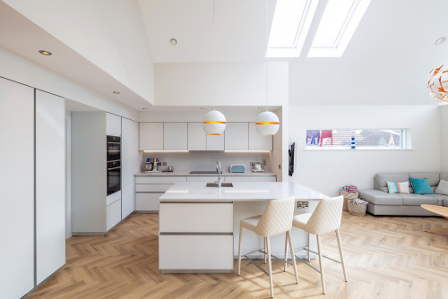 Classic All-White Kitchen: Herringbone Parquets and Bubble Pendants for a Timeless Look