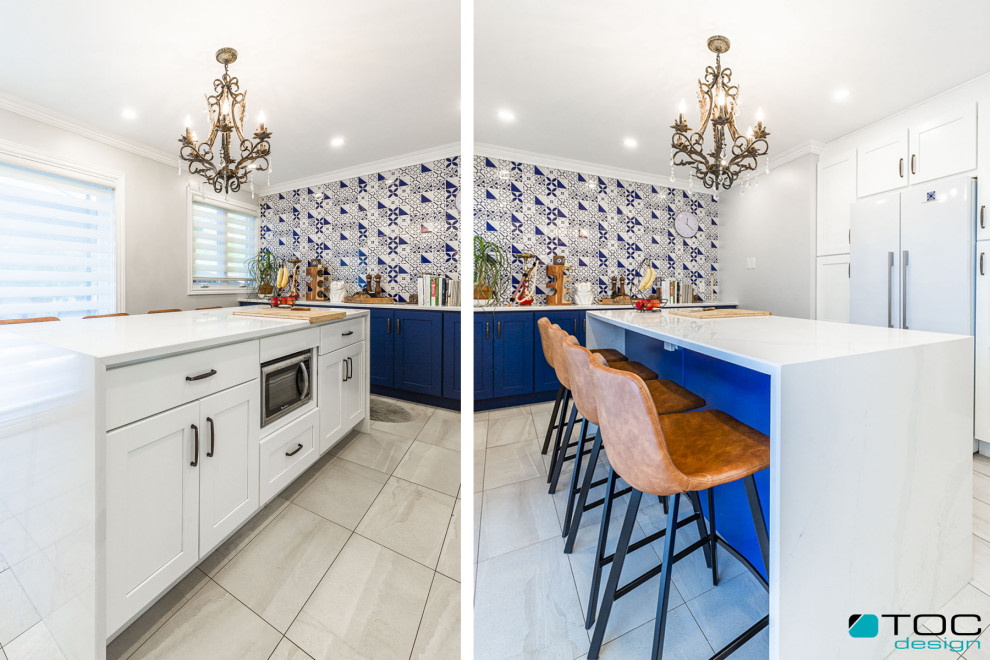 Example of a mid-sized tuscan galley porcelain tile and gray floor enclosed kitchen design in Other with an undermount sink, shaker cabinets, blue cabinets, quartz countertops, blue backsplash, ceramic backsplash, white appliances, an island and white countertops