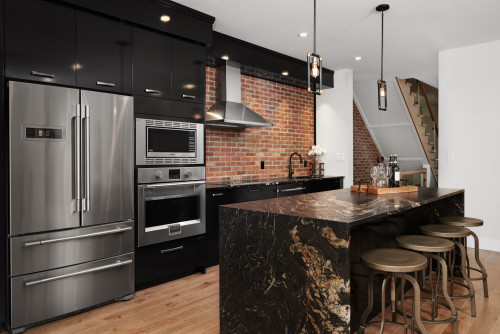 Luxurious Black Lacquer Cabinets with Brick Backsplash