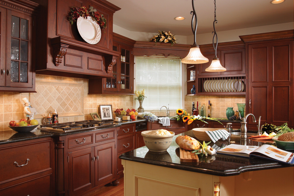 Enclosed kitchen - large traditional u-shaped dark wood floor and brown floor enclosed kitchen idea in Other with an undermount sink, beaded inset cabinets, dark wood cabinets, granite countertops, beige backsplash, ceramic backsplash, paneled appliances and an island