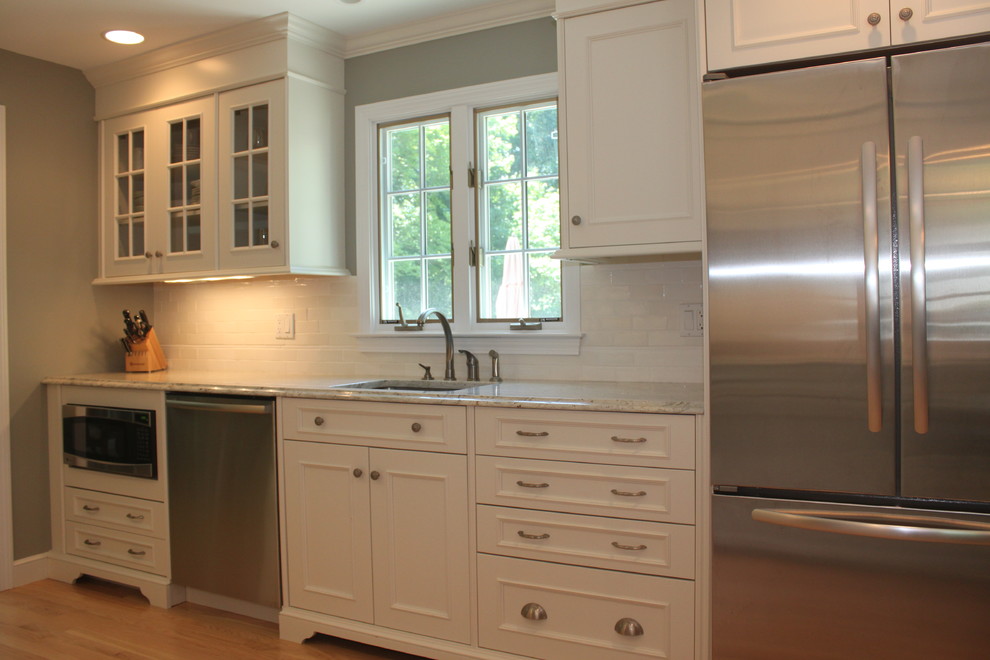 Inspiration for a mid-sized timeless galley eat-in kitchen remodel in Bridgeport with an undermount sink, beaded inset cabinets and subway tile backsplash