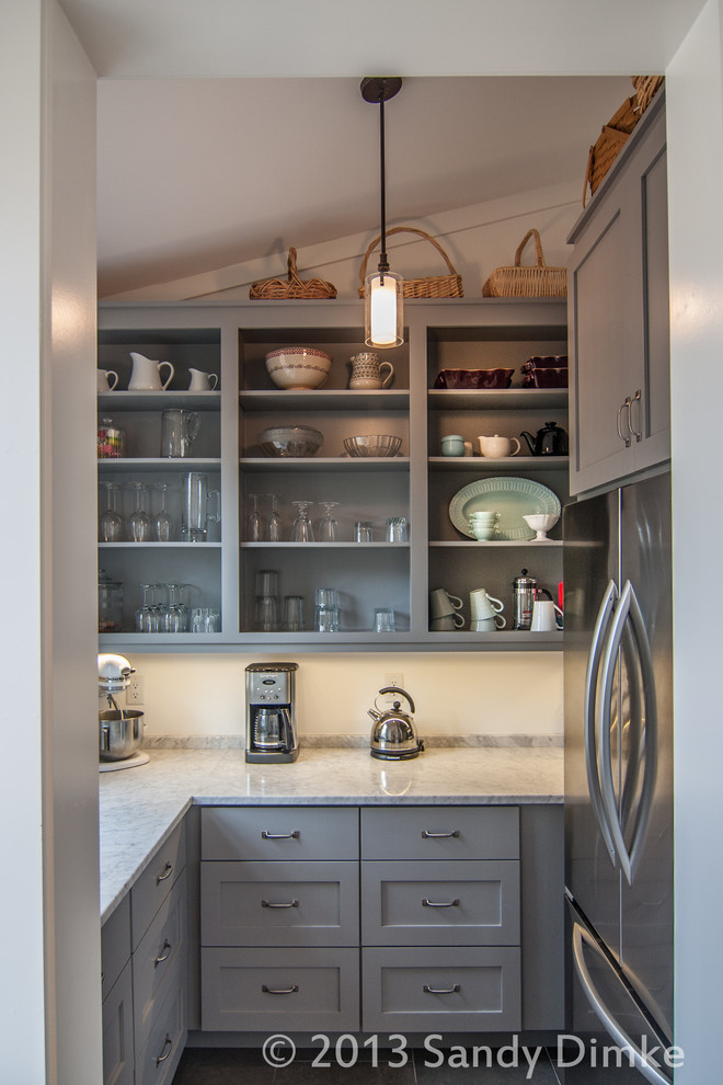 Example of a trendy kitchen design in Charleston with gray cabinets and open cabinets
