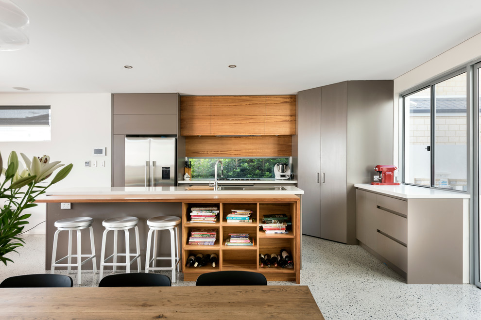 Photo of a medium sized contemporary galley kitchen/diner in Perth with a submerged sink, engineered stone countertops, glass sheet splashback, stainless steel appliances, concrete flooring and an island.