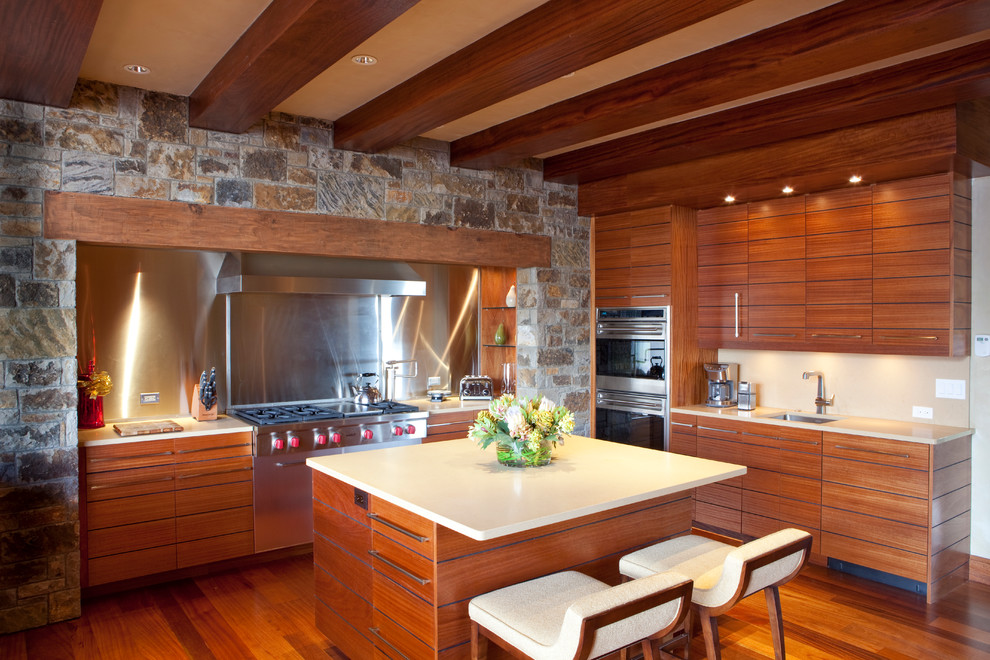 Contemporary kitchen in San Diego with medium wood cabinets, metallic splashback and beige worktops.