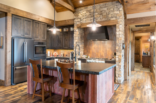 Red Wood Island Cabinets with Black Granite Countertops